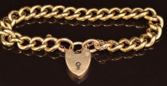 A 15ct gold curb link bracelet with heart padlock clasp, 22.9g, 20cm