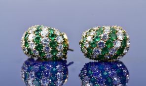 A pair of 18ct gold Van Cleef & Arpels earrings set with round cut emeralds and diamonds (total