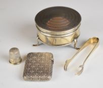 George V hallmarked silver dressing table pot with engine turned decoration, raised on three feet,