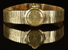 Marvin 9ct gold ladies wristwatch with gold hands and hour markers, silver dial and signed 17