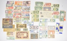 Collection of approximately eighty World and Bank of England banknotes including a K.O Peppiatt