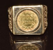 A 9ct gold ring set with a 1945 dos pesos gold coin, 7.8g, size Q