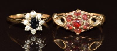 Two 9ct gold rings, one set with garnets and the other with sapphire and cubic zirconia, 3.2g,