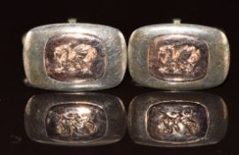 A pair of silver Clogau cufflinks with applied 9ct gold dragon decoration