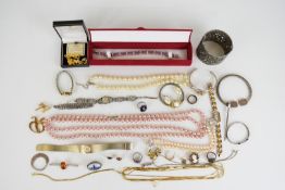 A collection of jewellery, some silver including bangle, christening bangle, brooch and earrings set