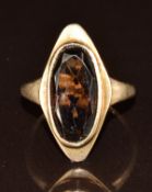A 9ct gold ring set with an oval cut smoky quartz, 3.7g, size J