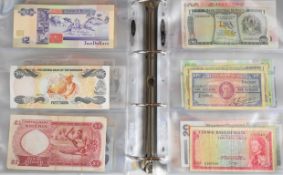 An album of all world banknotes including UK white £5, cashiers including Peppiett, O'Brien,