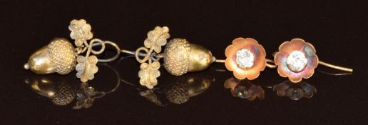 A pair of Victorian yellow metal earrings in the form of acorns and another pair of gilt earrings