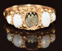 A 9ct gold ring set with opals (one missing), 1.3g, size N