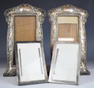 Two pairs of hallmarked silver photograph frames, one of Art Nouveau design, Birmingham 1911/15,