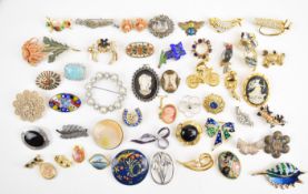 A collection of vintage brooches including agate, two silver filigree, silver set with onyx,