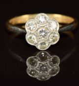 An 18ct gold ring set with diamonds in a platinum cluster setting, size K/L, 2.2g