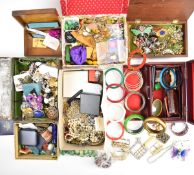 A collection of jewellery including vintage earrings, vintage brooches including Miracle, Siam