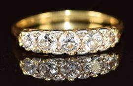 An 18ct gold ring set with five diamonds, total diamond weight approximately 0.7ct, 2.7g, size L