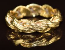 An 18ct gold ring in a textured plaited design, 6.2g, size O