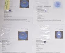 Eight loose tanzanite cabochons (totalling approximately 21.4ct) and five round cut tanzanites (