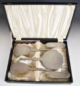 Mappin and Webb cased hallmarked silver dressing table set with engine turned decoration, comprising