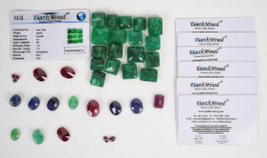 A collection of loose gemstones including 18 emerald cut emeralds (378ct), three oval emeralds (21.