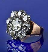 Victorian gold ring set with old cut diamonds in a large foiled cluster setting, the central diamond