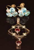 A pair of 9ct gold earrings each set with three round cut blue zircon and a white zircon, and a