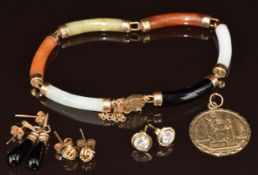 A 9ct gold St Christopher pendant, three pairs of 9ct gold earrings including knots, onyx and