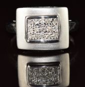 A 9ct white gold ring set with 15 diamonds in a rectangular setting, 2.9g, size N