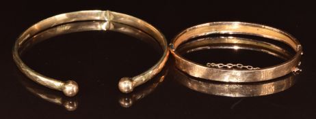 A 9ct rose gold bangle engraved 'Lilla' and a 9ct flapper bangle with faceted decoration, Birmingham