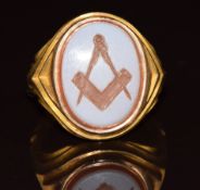 A 15ct gold signet ring set with a carved agate intaglio depicting a Masonic symbol, 6.4g, size L