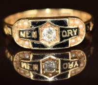 An 18ct gold mourning ring set with a diamond, seed pearls and black enamel reading 'In Memory of'