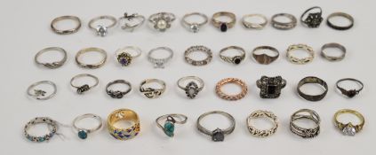 Thirty- five silver rings including cubic zirconia, turquoise, pearl, enamel, marcasite, etc, 89g