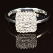 A 9ct white gold ring set with diamonds in a tiered square setting, 2.8g, size P