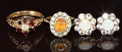 A 9ct gold ring set with quartz and garnets (2.8g, one garnet missing), a 9ct gold and silver ring