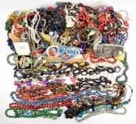 A collection of jewellery, mainly beaded necklaces including cinnabar lacquer, faux pearls, glass,