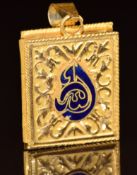 A yellow metal locket in the form of a Koran set with enamel,  10.4g, 4 x 2.2cm (tests as 21ct