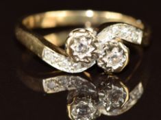 A 9ct gold ring set with diamonds in a twist setting, 2.3g, size L