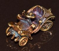 A 9ct gold charm in the form of a car, 4.8g