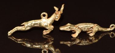 Two 9ct gold charms, one in the form of a springbok and the other an articulated crocodile, 5g