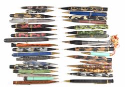 Thirty-four propelling pencils including Ronson with built in lighter, Eversharp, Mabie Todd & Co,