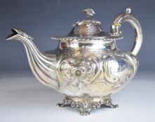Victorian hallmarked silver teapot with embossed floral decoration, gadrooned edge, ivory