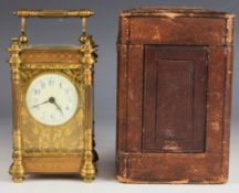 Late 19th or early 20th century gilt cased carriage clock with bevelled glass and fretwork