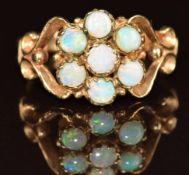 A 9ct gold ring set with a cluster of opals, 2.9g, size M