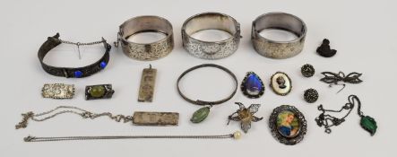A collection of silver jewellery including two Walker & Hall bangles, two other bangles, Arts &