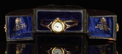 Unnamed 18ct gold ladies wristwatch with black hands and Roman numerals, white dial and unsigned