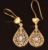 A pair of 18ct gold earrings made up of a pierced pear shape drop, 1.5g