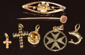 An 18k gold cross pendant set with sapphires (1.2g), 18k gold cross charm/ pendant (0.4g), 14k