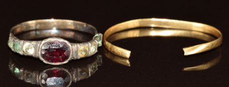 An 18ct gold wedding band (0.6g) and a Georgian ring set with a foiled garnet and paste (both