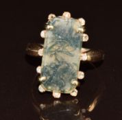 Victorian yellow metal ring set with moss agate surrounded by rose cut diamonds (three missing), 4.