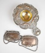 Victorian hallmarked silver tea strainer with decoration of cherubs, import marks for London 1896,