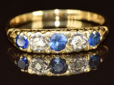 An 18ct gold ring set with sapphires and diamonds, 3.7g, size R
