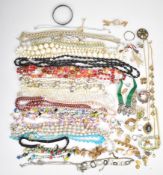 A collection of jewellery including gilt cufflinks, 9ct gold back and front locket with scrolling